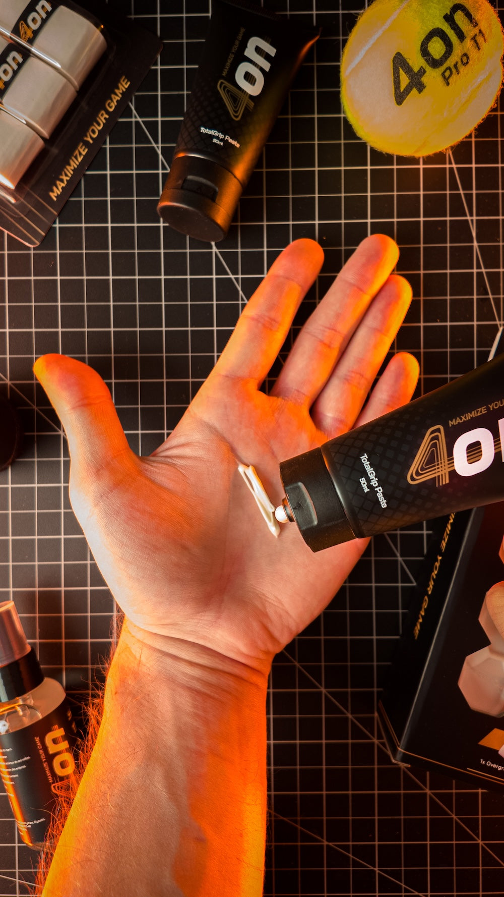 4on TotalGrip Paste tube photographed vertically in a lifestyle product image.